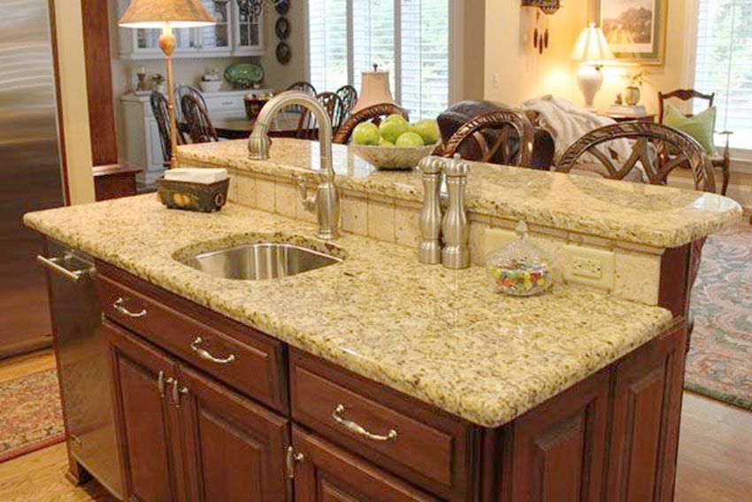 Renovation on a kitchen island with a new granite countertop.